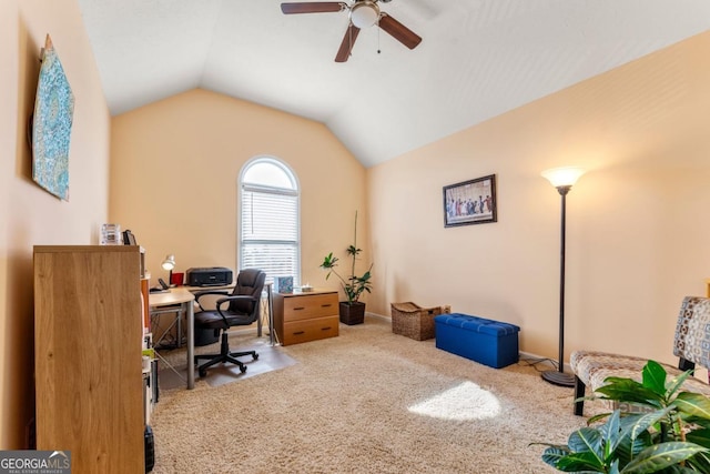 home office featuring ceiling fan, carpet flooring, and vaulted ceiling