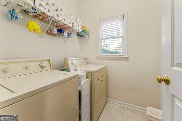 washroom featuring washer and dryer