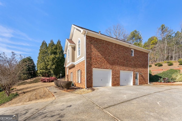 view of side of property featuring a garage