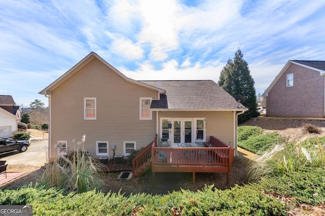 rear view of property featuring a deck