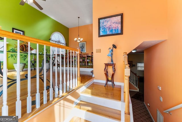 hall with an inviting chandelier and hardwood / wood-style floors