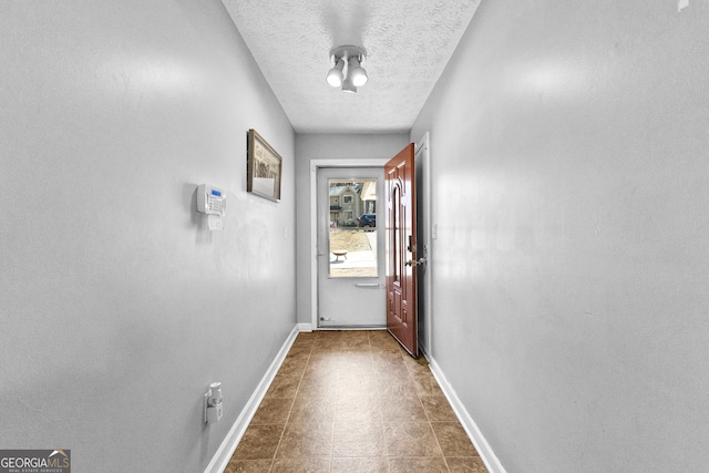 entryway with a textured ceiling