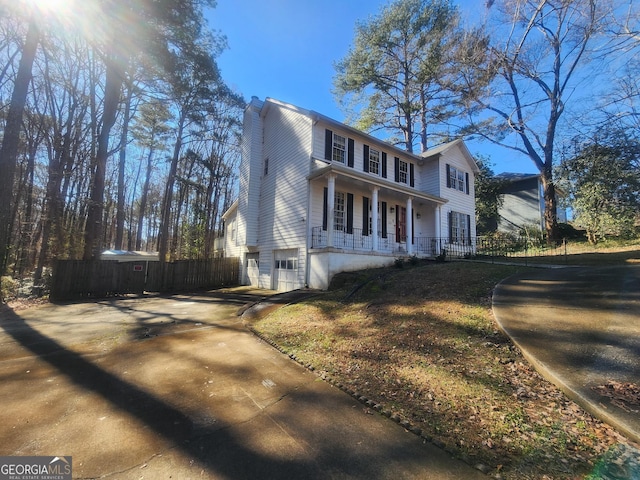 view of front facade featuring a garage and covered porch