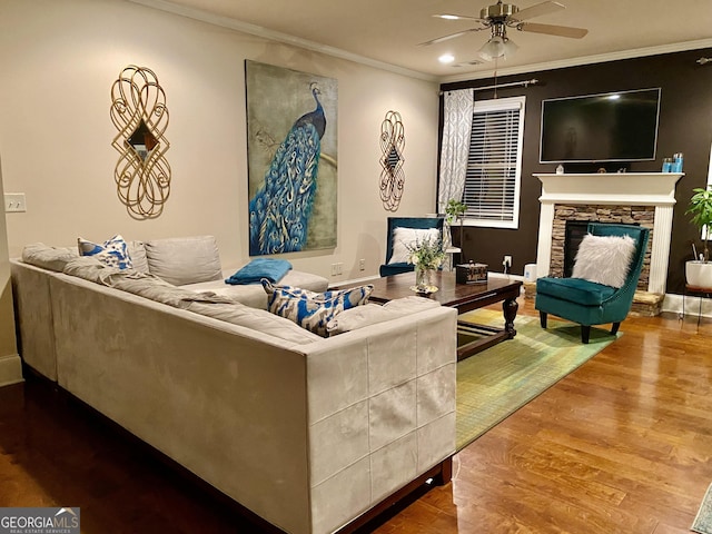 1320 Newbridge Cir, Buford, GA 30519 - living area with ornamental molding, a ceiling fan, wood finished floors, a fireplace, and recessed lighting
