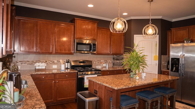 1320 Newbridge Cir, Buford, GA 30519 - kitchen featuring stainless steel appliances, a kitchen island, light stone counters, tasteful backsplash, and a kitchen breakfast bar