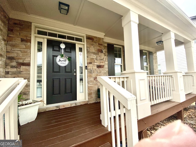 1320 Newbridge Cir, Buford, GA 30519 - doorway to property featuring stone siding and covered porch