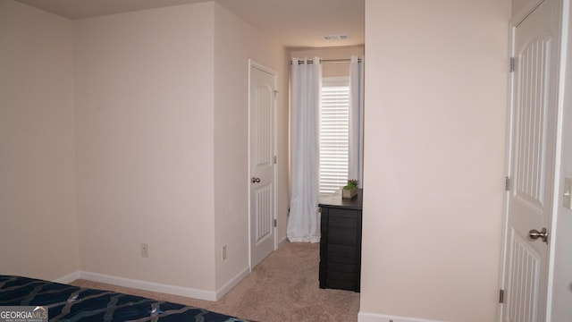 1320 Newbridge Cir, Buford, GA 30519 - unfurnished bedroom featuring light colored carpet and baseboards