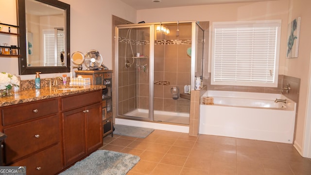 1320 Newbridge Cir, Buford, GA 30519 - full bathroom featuring vanity, a shower stall, a garden tub, and tile patterned flooring