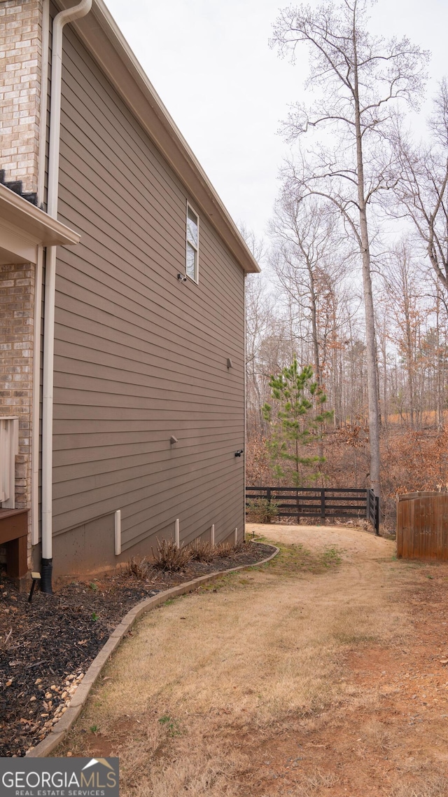 1320 Newbridge Cir, Buford, GA 30519 - view of side of home featuring brick siding