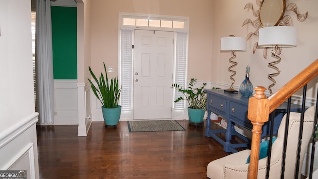 1320 Newbridge Cir, Buford, GA 30519 - foyer entrance featuring a wainscoted wall, wood finished floors, and arched walkways