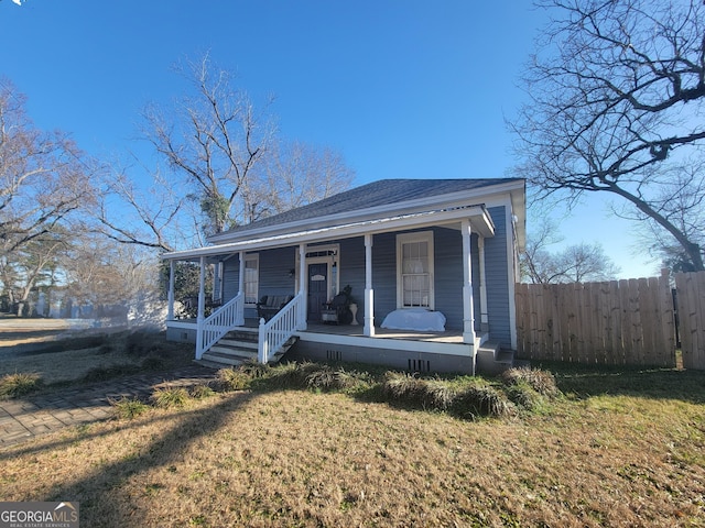 view of front of house featuring a front lawn and a porch