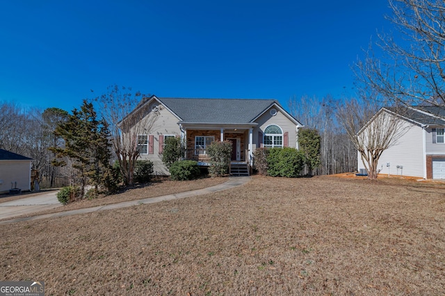 single story home with a porch and a front lawn