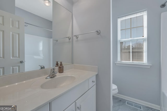 bathroom with vanity and toilet