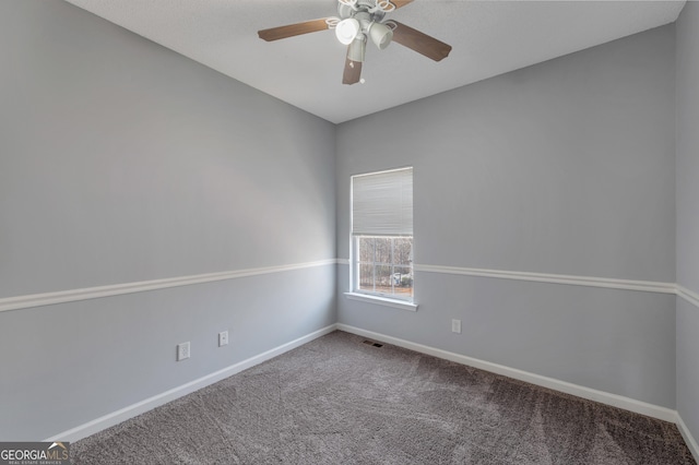 empty room featuring carpet and ceiling fan