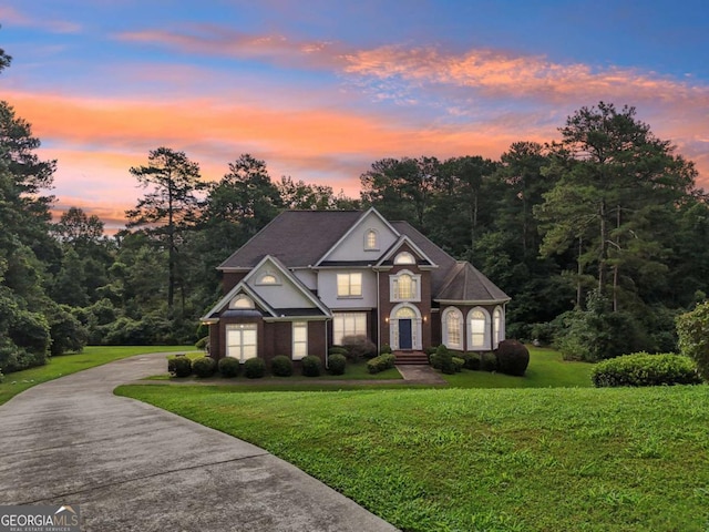 view of front of home with a lawn