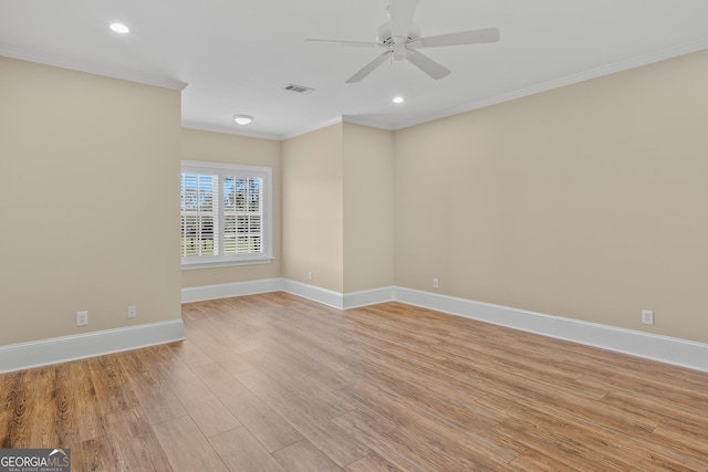 unfurnished room featuring crown molding, ceiling fan, and light hardwood / wood-style floors