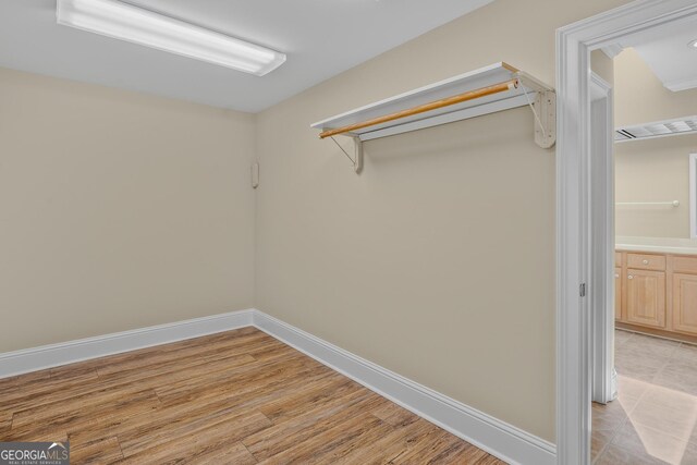 walk in closet featuring light wood-type flooring