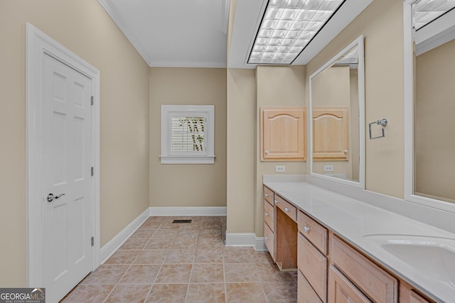 bathroom featuring tile patterned flooring, vanity, and ornamental molding