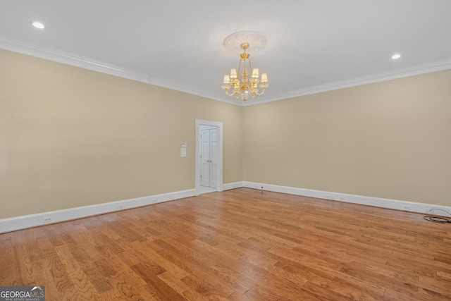 unfurnished room featuring crown molding and light hardwood / wood-style flooring