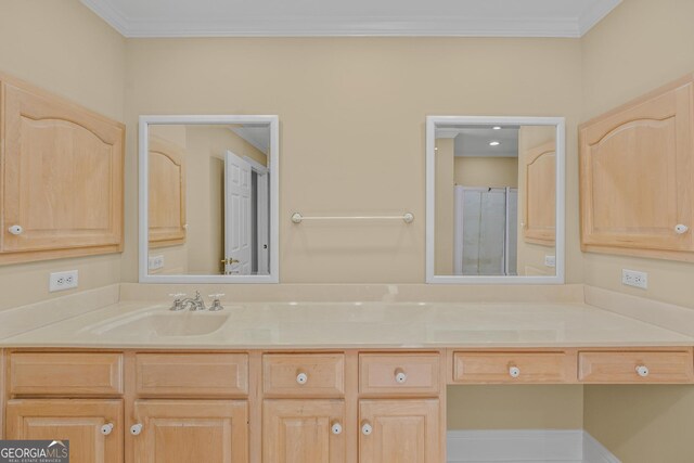 bathroom featuring ornamental molding, vanity, and walk in shower