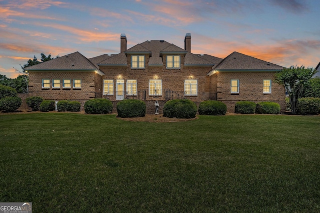 view of front of home with a lawn