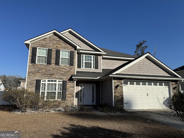 view of front facade with stone siding, an attached garage, and concrete driveway