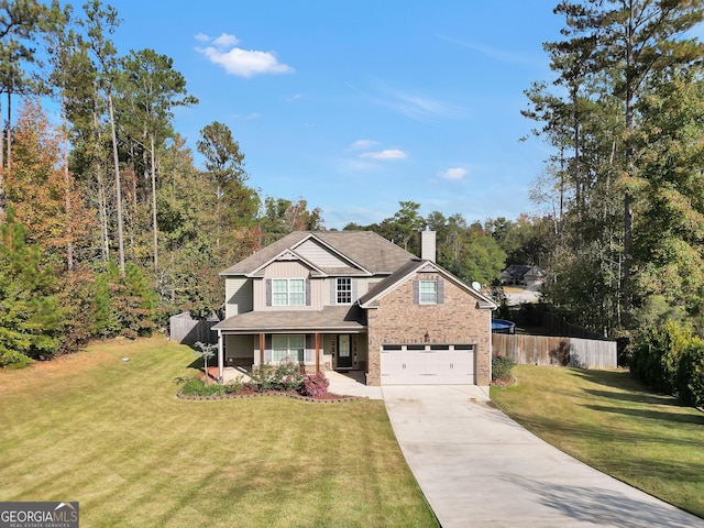 view of front of home featuring a garage, a front yard, and a porch