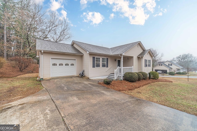 ranch-style house with a garage and a front yard