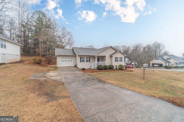 view of front facade featuring a garage and a front lawn