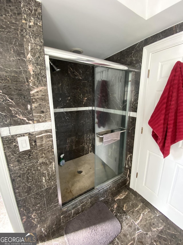 bathroom featuring an enclosed shower