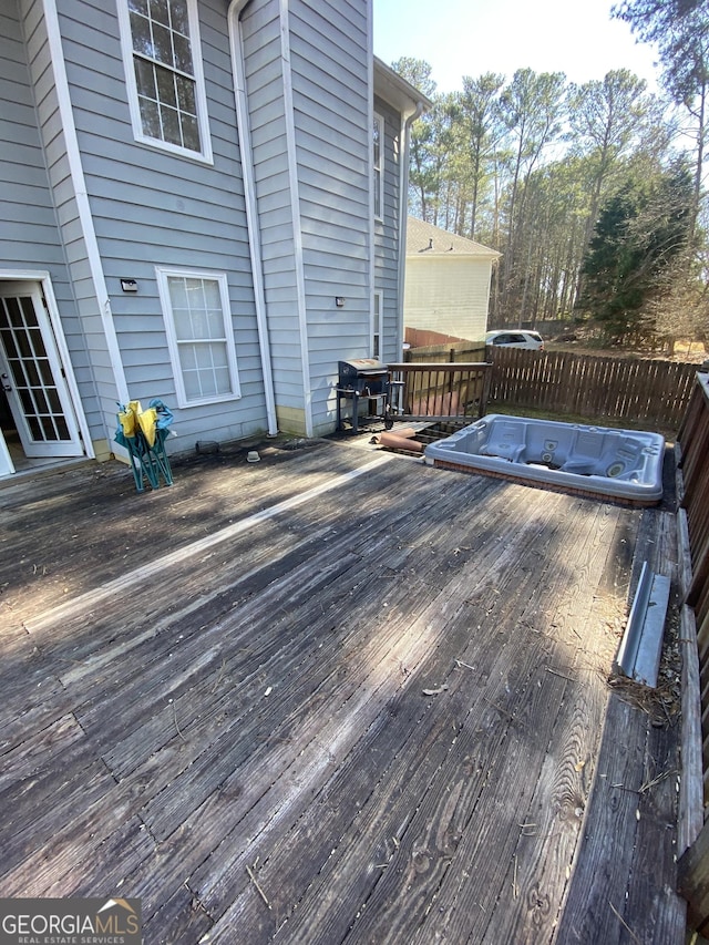 wooden deck with area for grilling