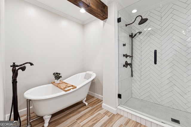 bathroom with beamed ceiling, ornamental molding, wood-type flooring, and plus walk in shower