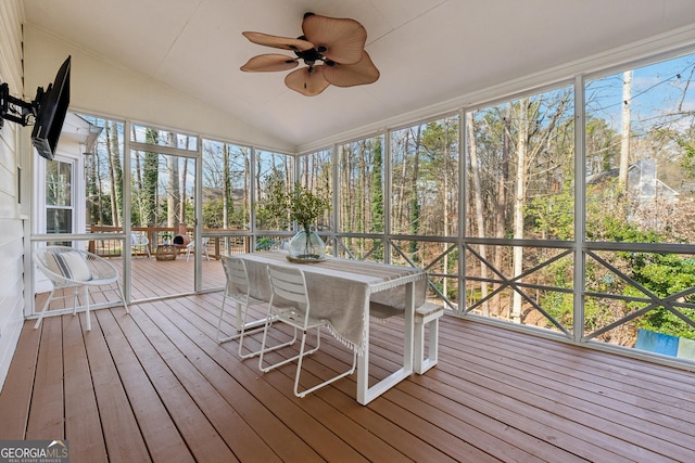 unfurnished sunroom with lofted ceiling and ceiling fan