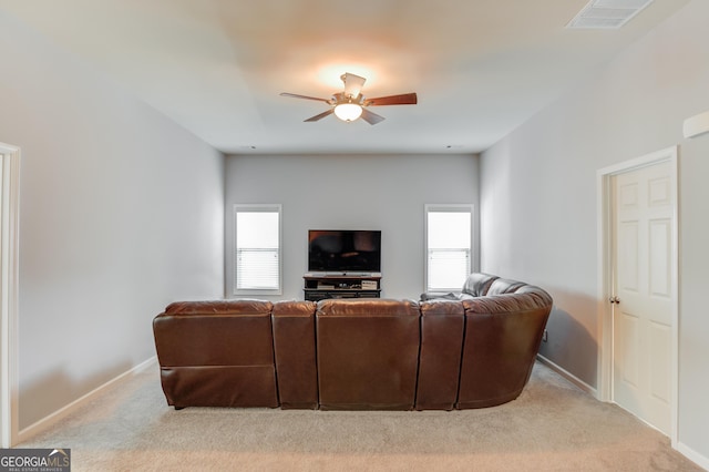 living room featuring light carpet and ceiling fan