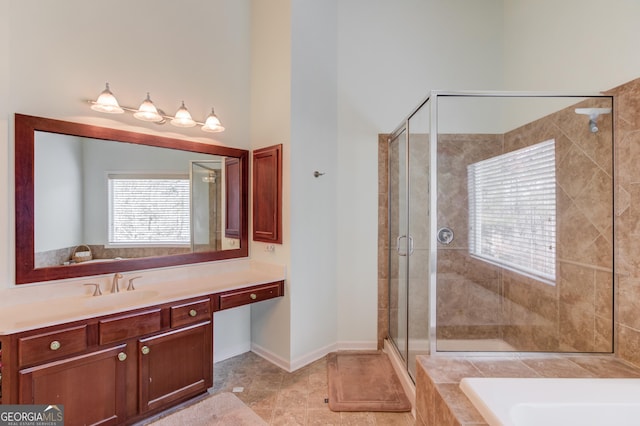 bathroom with vanity, tile patterned flooring, independent shower and bath, and a high ceiling