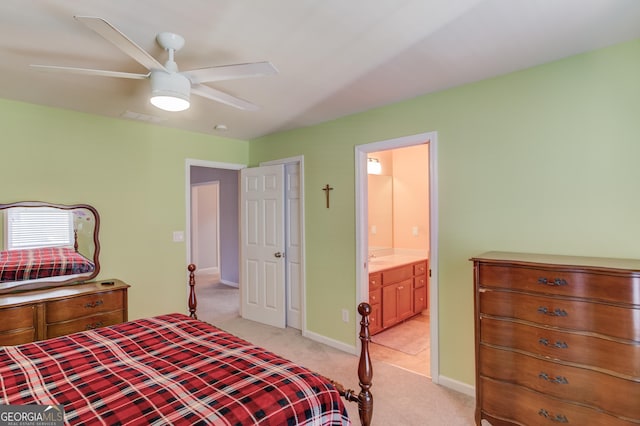 carpeted bedroom featuring connected bathroom and ceiling fan