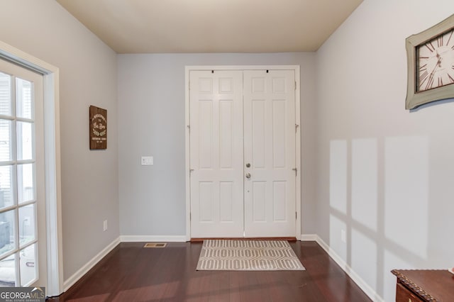 entrance foyer with dark hardwood / wood-style flooring