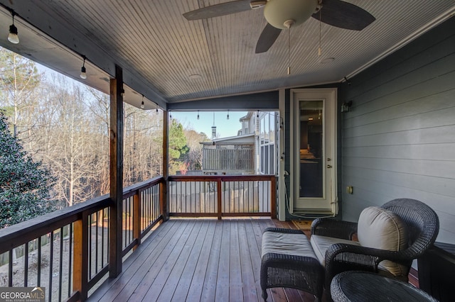 wooden terrace featuring ceiling fan