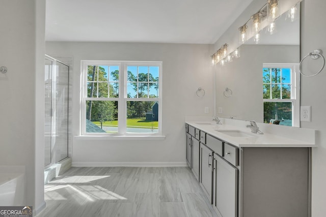 bathroom featuring vanity and an enclosed shower