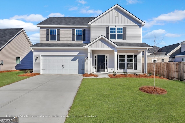 view of front of home with a garage and a front yard