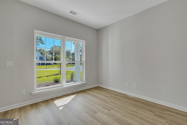 unfurnished room featuring light wood-type flooring