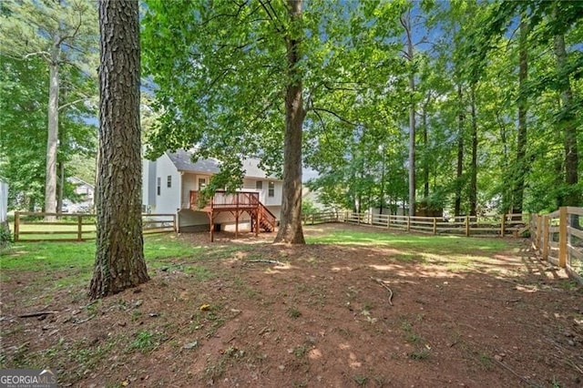 view of yard featuring a wooden deck