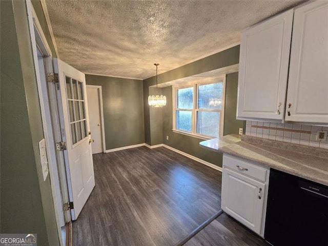 kitchen with black dishwasher, hanging light fixtures, and white cabinets