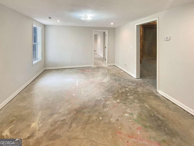 empty room with a textured ceiling