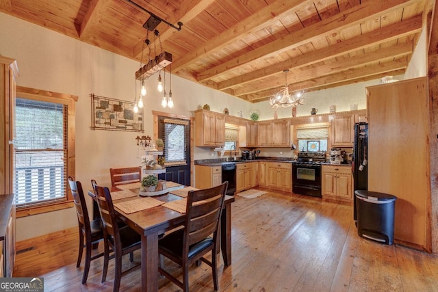 dining area with an inviting chandelier, wood ceiling, light hardwood / wood-style floors, and beamed ceiling