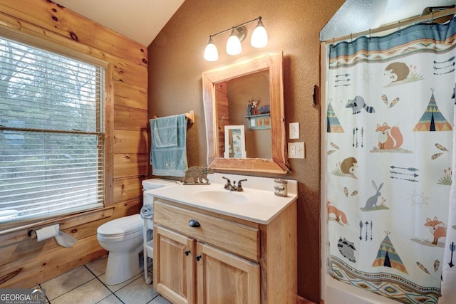 bathroom featuring vanity, tile patterned floors, wooden walls, and a shower with curtain