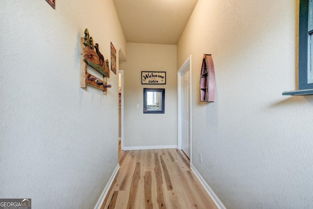 hall with light wood-type flooring