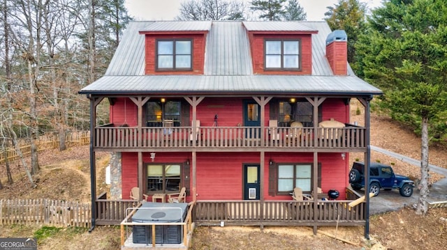 view of front of home with a balcony and covered porch