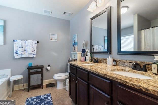 bathroom with vanity and toilet