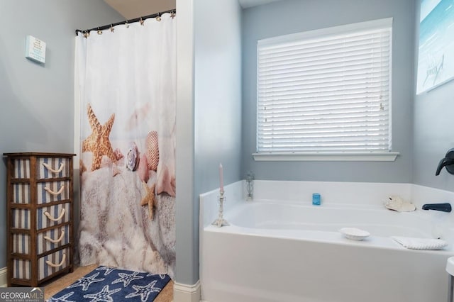 bathroom featuring a tub